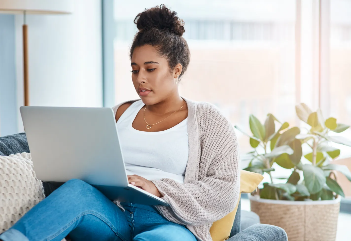 Woman technology laptop sweater couch